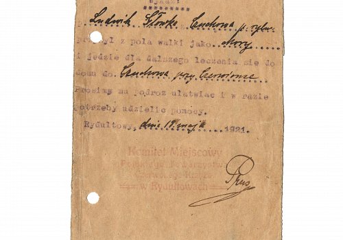 Wymiary: wysokość - 12 cm, szerokość - 10,5 cm; Materiał: papier; Technika: druk maszynowy i odręczny; Pochodzenie: Rydułtowy, G&oacute;rny Śląsk; Datacja: 18.V.1921 r. 
Skierowanie&nbsp; z dnia 18 maja 1921 roku na dalsze leczenie do domu L. Gł&oacute;wki. Wydane przez Komitet Miejscowy Polskiego Towarzystwa Czerwonego Krzyża.